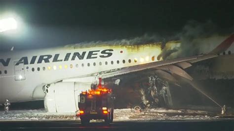 Plane burns on runway at Tokyo airport after collision, five dead